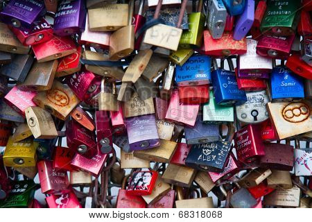 COLOGNE, GERMANY - MAY 29, 2014, Thousands of love locks which sweethearts lock to the Hohenzollern Bridge to symbolize their love on May 29 in Koln, Germany 