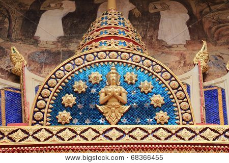 Deva statue on tympanum