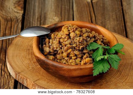 Cooked Lentils In Wooden Bowl Witn Metal Spoon