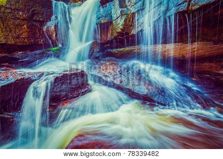 Vintage retro effect filtered hipster style image of tropical waterfall. Popokvil Waterfall, Bokor National Park, Cambodia
