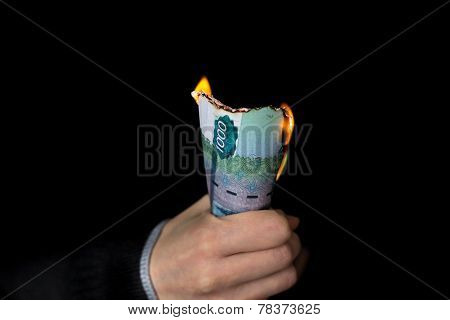 Pack Of Burning Rubles In Person's Hand Horizontal