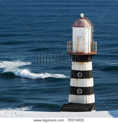 Lighthouse On Coast Of Pacific Ocean. Kamchatka Peninsula