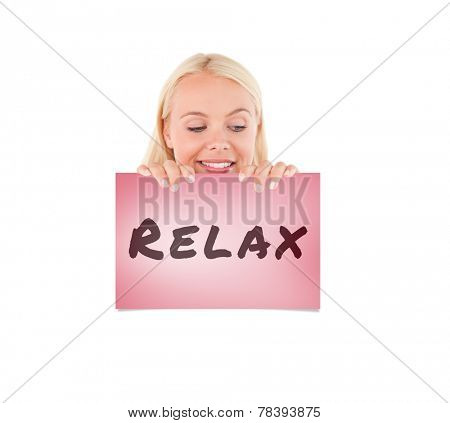 Woman peeking over a whiteboard against pink card