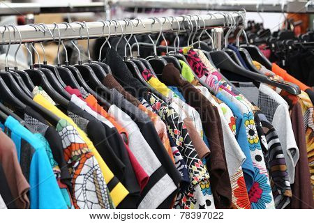 Vintage Clothes Of Many Colors For Sale At Flea Market