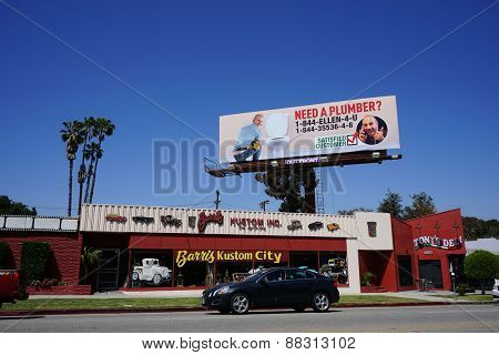 LOS ANGELES - APR 17: Matt Lauer pranks Ellen DeGeneres with a huge billboard in which she is shown as a plumber on April 17, 2015 in Los Angeles, California