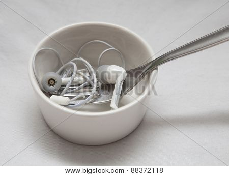 Earplugs with fork in little bowl