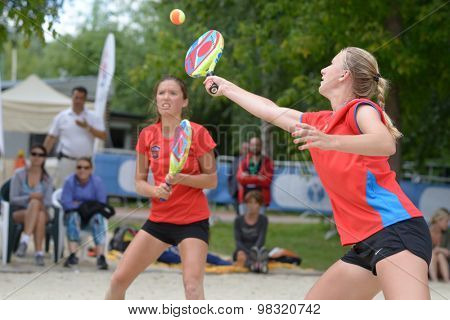 MOSCOW, RUSSIA - JULY 18, 2015: Irina Glimakova (right) and Julia Chubarova of Russia in the semifinal match of the Beach Tennis World Team Championship against Brazil. Russia won the match 2-1