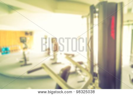 Abstract blur Fitness center with traineger equipments  ( Filtered image processed vintage effect. )