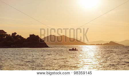 Beautiful Sunset on the sea, in the background mountains