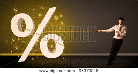 Business man pulling rope with big procent symbol sign concept on background