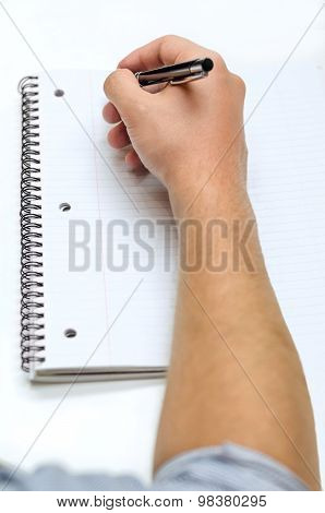Man's Hand Drawing In A Notebook