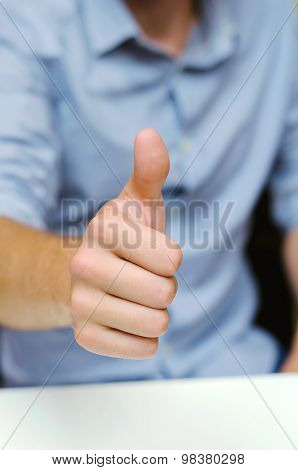 Man In Office Showing Thumbs Up