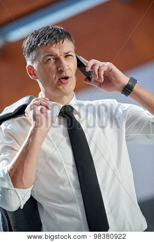 business man using phone at modern office space