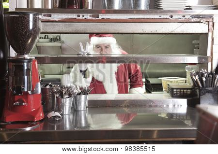 Santa claus smiling in undustrial kitchen