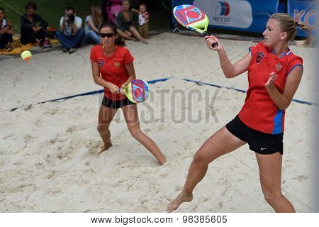 MOSCOW, RUSSIA - JULY 18, 2015: Irina Glimakova (right) and Julia Chubarova of Russia in the semifinal match of the Beach Tennis World Team Championship against Brazil. Russia won the match 2-1