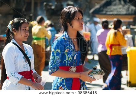 People praying in Turta Empul temple in Bali, Indonesia.