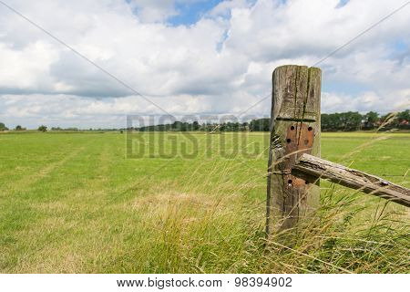 Old wooden fence in the Dutch pastures