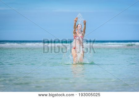Woman Enjoying The Sea And Waves Of Atlantic Ocean.