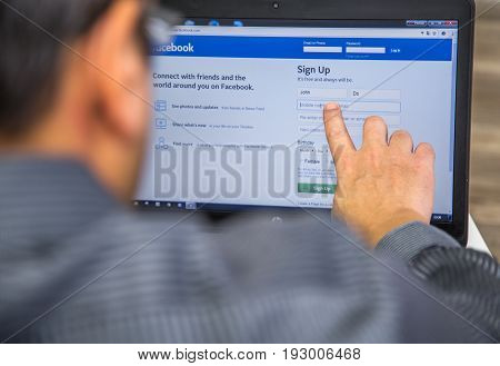 Paris, France - January 27, 2017 : Man Using A Laptop With Touch Screen To Create A User Account On