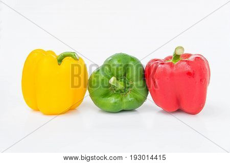 sweet pepper thee color red yellow green isolated in white background raw vegetables