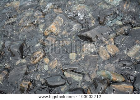 Black stones beach as a background, Black stone using as a background.