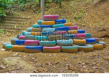 Unsual pile of colored tires at nature
