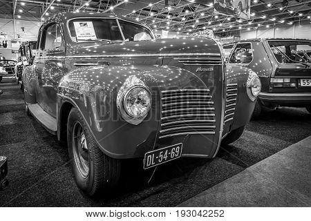 MAASTRICHT NETHERLANDS - JANUARY 15 2016: Full-size car Plymouth Deluxe (P10) Business Coupe 1941. Black and white. International Exhibition InterClassics & Topmobiel 2016
