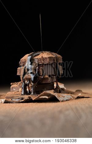 Porous chocolate sprinkled with syrup