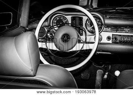 MAASTRICHT NETHERLANDS - JANUARY 15 2016: Cabin of sports car Mercedes-Benz 230SL (W113). Black and white. International Exhibition InterClassics & Topmobiel 2016