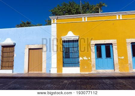 Yellow and blue colonial architecture in historic Campeche Mexico