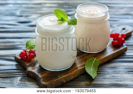 Homemade Yogurt And Sour Baked Milk In Glass Jars.