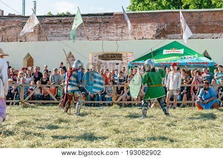 TROSTYANETS, UKRAINE - JUNE 25, 2017: Old Castle fest in action. Knights fight just beginning. This is 8 time traditional fest with historical costumes, foods and fights.