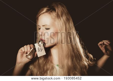 beautiful blond daring young woman with red lips big eyes and earrings. Evening make-up