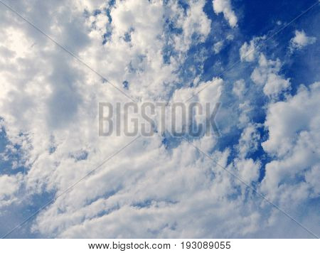 Blue sky full of gray white clouds