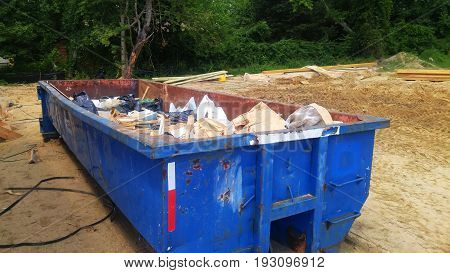 Dumpsters Being Full With Garbage