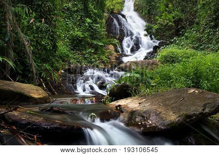 a cascade of water falling from a height, formed when a river or stream flows over a precipice or steep incline