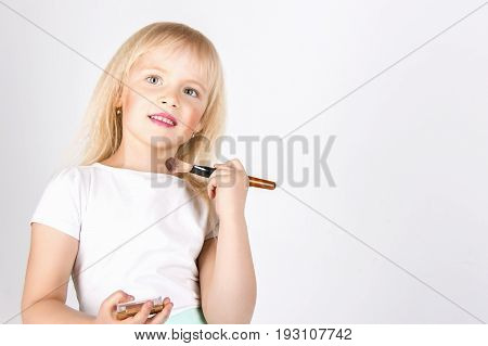 Little Happy Girl Looking In The Mirror Colors Face,