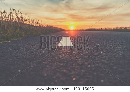 Sunset and lightning in beautiful countryside landscape along the road in the Netherlands.