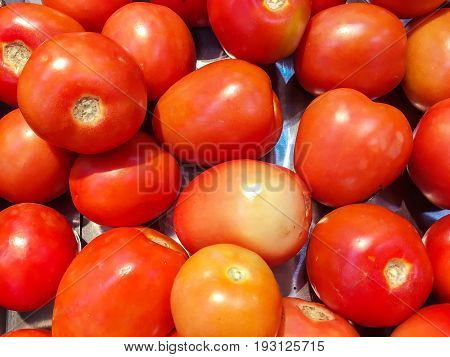 Fresh and ripe red tomatoes organic in the market