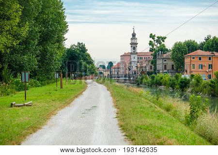 Battaglia Terme, Italy - June, 27, 2017: bank of a city channel in Battaglia Terme, Italy
