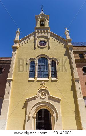 Yellow Facade Of A Church At The Plaza Vicent Iborra In Valencia