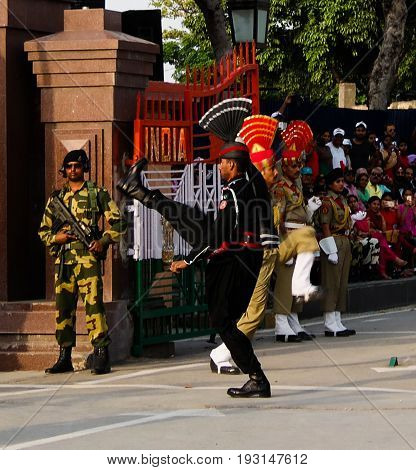 The marching Pakistani and Indian guards in national uniform at the ceremony of lowering the flags - 04-05-2015 border between Pakistan and India Wagah Lahore Pakistan