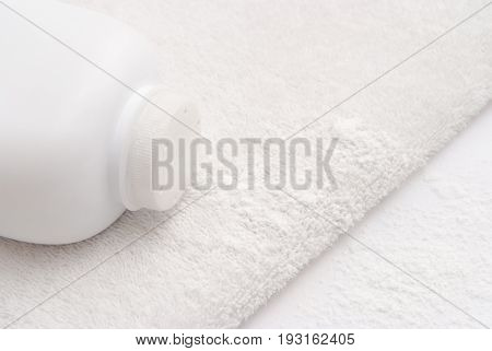 Talcum Powder On A Soft White Towel Background