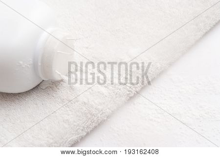 Talcum Powder On A Soft White Towel Background