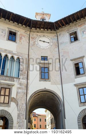 A buildin with an ancient clock in Pisa Italy