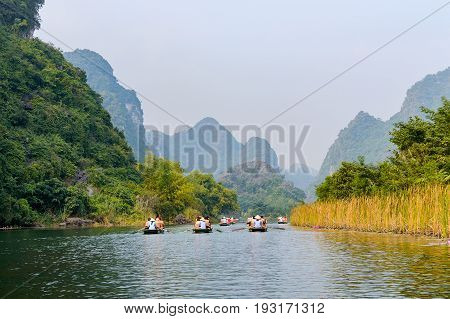 International Tourists Traveling On Local Vietnamese Small Boat