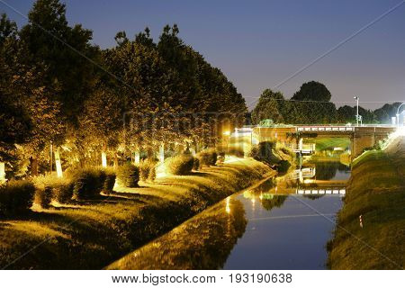 night landscape with the image of channel in Rovigo, Italy