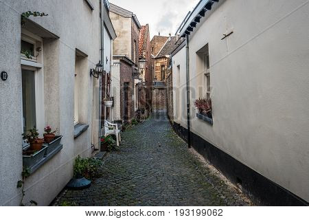 MAASTRICHT NETHERLANDS - JANUARY 16 2016: Old streets in the historic center. Maastricht is the oldest city of the Netherlands and the capital city of the province of Limburg.