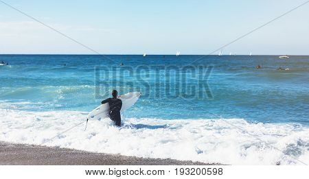 Surfer girl holding surfboard on background sea scape sand beach coastline. Panorama horizon perspective view ocean sunlight. Travel summer sport concept backdrop sunny waves seascape mock up