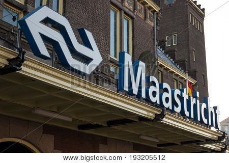 MAASTRICHT NETHERLANDS - JANUARY 17 2016: A sign on the building's main train station. Maastricht is the oldest city of the Netherlands and the capital city of the province of Limburg.